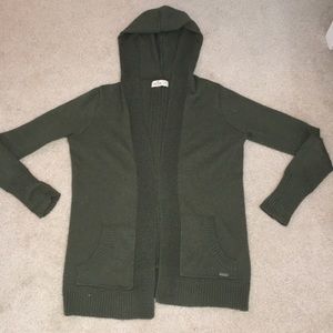 Dark green cardigan.